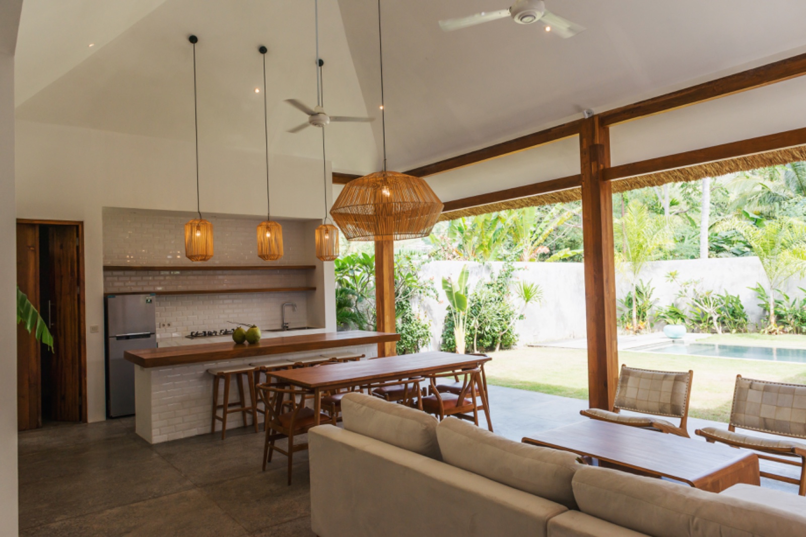 Villa kitchen and dining with pool view